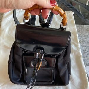Gucci tassel oval mini backpack bambu Black impressive condition original dustba